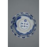 A blue and white bowl, Kangxi mark and period. The rounded sides rising from a slightly spreading