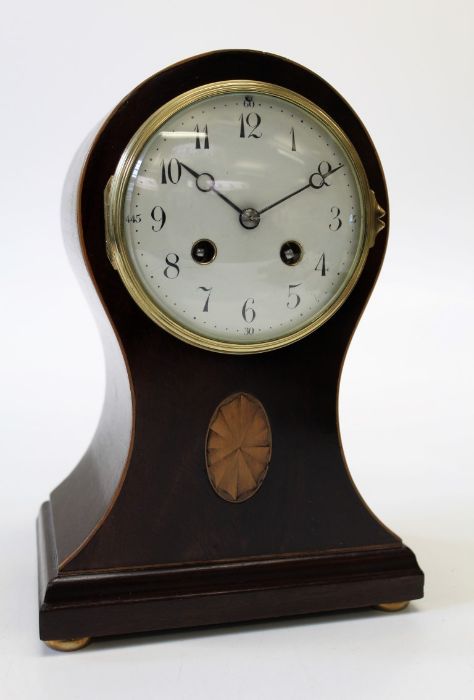 A late 19th century French mantle clock, the boxwood strung balloon case with fan inlay enclosing an