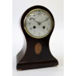 A late 19th century French mantle clock, the boxwood strung balloon case with fan inlay enclosing an
