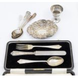 An assorted collection of silver to include: A Chester hallmarked small bonbon dish - pierced