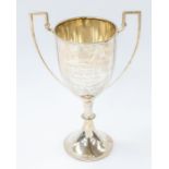 A George V silver two handled presentation cup and cover, engraved inscription reads: R.N HUNT