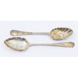 Two George III silver and parcel gilt berry spoons, one hallmarked by Soloman Hougham, London, 1813,
