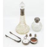 A collection of silver to include: George V silver mounted glass spirit decanter and stopper,