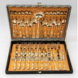 An Italian plated 12 piece canteen of cutlery, ornate hour glass pattern, comprising 12 knives,