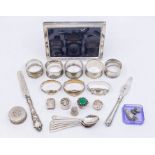 A collection of silver to include napkin rings, spoons, frames, pill boxes etc., various dates and