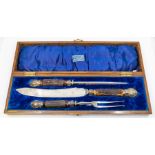 A Victorian style early 20th century antler horn, plated and steel three piece carving set, in
