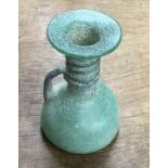 Late Roman glass grave offering flask. Approximately 11cm tall and 8cm wide.