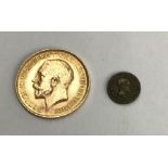 George V 1913 half Sovereign with a commemorative toy money coin commemorating birth of Princess