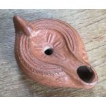 Late Roman North African Grave Offering Decorated Samian oil lamp. Approximately 11cm long and 4.5cm