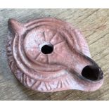 Late Roman North African Grave Offering Decorated Samian oil lamp. Approximately 11cm long and 4cm
