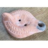 Late Roman North African Grave Offering Decorated Samian oil lamp. Approximately 13cm long and 5cm