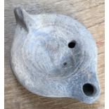 Late Roman North African Grave Offering decorated oil lamp. Approximately 11cm long and 5cm high.