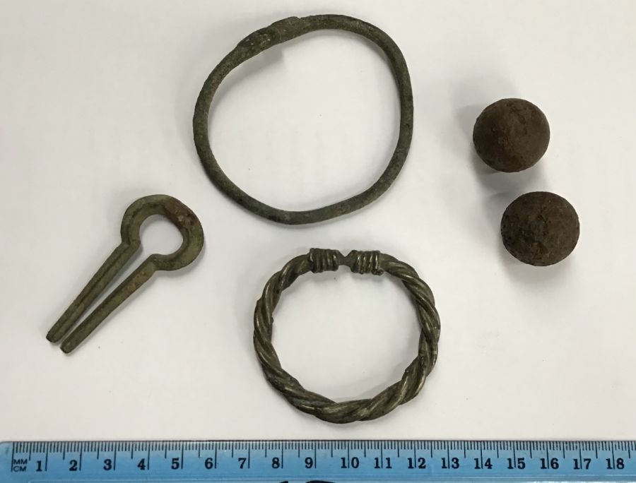 Three Roman Period jewellery items of two bracelets and one hair pin (6cm), one of the bracelets