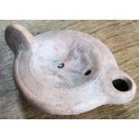 Late Roman North African Grave Offering Decorated Samian oil lamp. Approximately 12cm long and 4cm