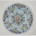 A mid 18th century Lambeth Delftware plate, painted in colours, diameter 22.6cm. Condition note: