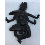 A small 20th century Indian bronze figure of four armed Kali, lacking base, height 10.2cm