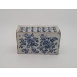 A mid 18th Lambeth Delftware flower brick, painted in blue, length 15.4cm. Condition note: loss of