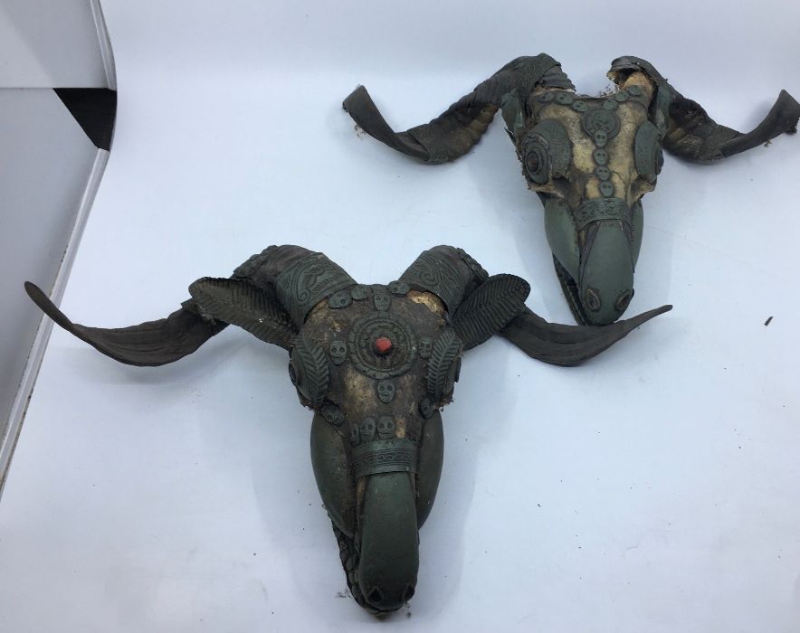 Two 20th century Sino-Tibetan metal mounted goat sculls. probably Nepalese. (2)