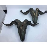 Two 20th century Sino-Tibetan metal mounted goat sculls. probably Nepalese. (2)