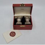 A Cartier silver salt and pepper set, each stamped "Sterling", in Cartier fitted box.