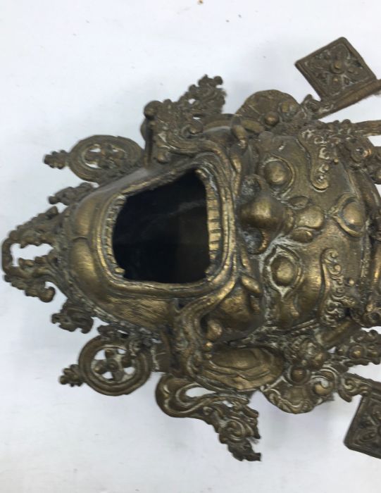 A 20th century Sino-Tibetan bronze censer, fashioned as the mask of a fierce protective deity, - Image 3 of 5