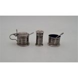 A silver three piece cruet set, by Adie Brothers Ltd, Birmingham 1934, all with pierced side and