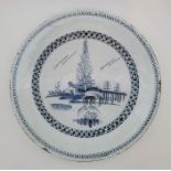 An 18th century English Delftware charger, painted in blue, diameter 34cm, height 4.8cm. Condition