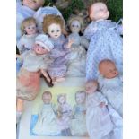 A large collection of antique bisque headed dolls and others