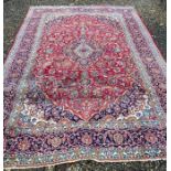 A large Persian style rug and others