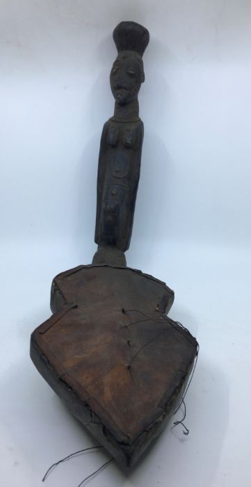 A 20th century African tribal carved wooden stringed musical instrument.