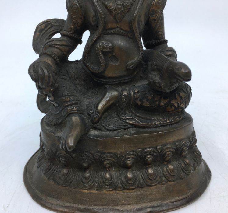A 20th century Sino-Tibetan bronze figure of Jambhala, height 16cm. - Image 3 of 5