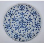 An 18th century English Delftware charger, painted in blue, diameter 33.9cm, height 4cm. Condition