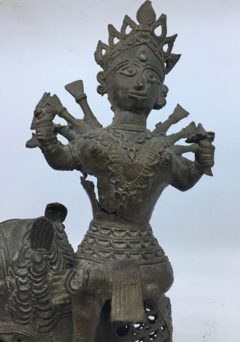A 20th century Indian bronze figure of a deity upon a lion, height 33cm. - Image 2 of 5