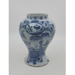 A mid 18th century English Delftware jar, painted in blue, height 19.1cm. Condition note: loss of