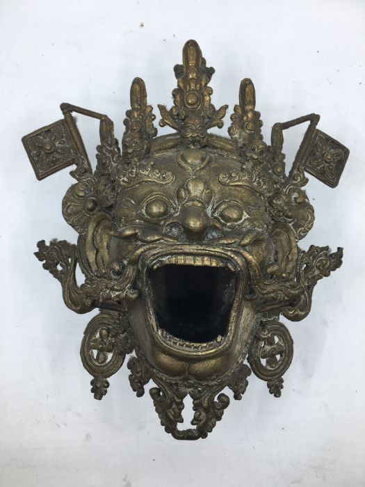 A 20th century Sino-Tibetan bronze censer, fashioned as the mask of a fierce protective deity,