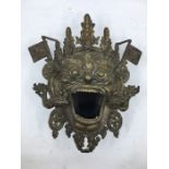 A 20th century Sino-Tibetan bronze censer, fashioned as the mask of a fierce protective deity,