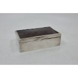 A silver and tortoiseshell mounted cigarette box, Birmingham 1922, makers' mark rubbed, 14cm x 8.5cm