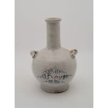 An early 18th century English Delftware twin handled bottle, underglaze painted "Roy", height 18.