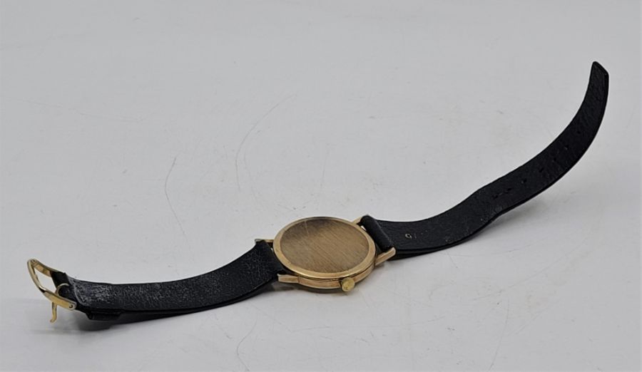 A Garrard 9ct. gold gentleman's quartz wrist watch, c.1984, having signed circular silvered dial - Image 4 of 6