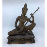 An Indian bronze figure of Saraswati seated playing the Veena, late19th/early 20th century, traces