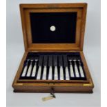 A set silver plated, silver collared and mother of pearl handled dessert knives and forks for