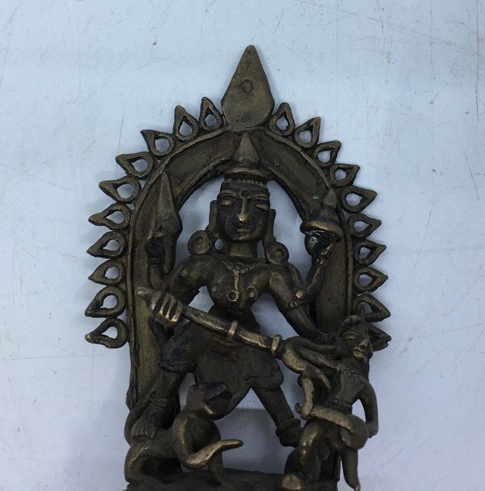 A late 19th/early 20th century Indian bronze figure of four armed Durga, height 11.8cm. - Image 2 of 6