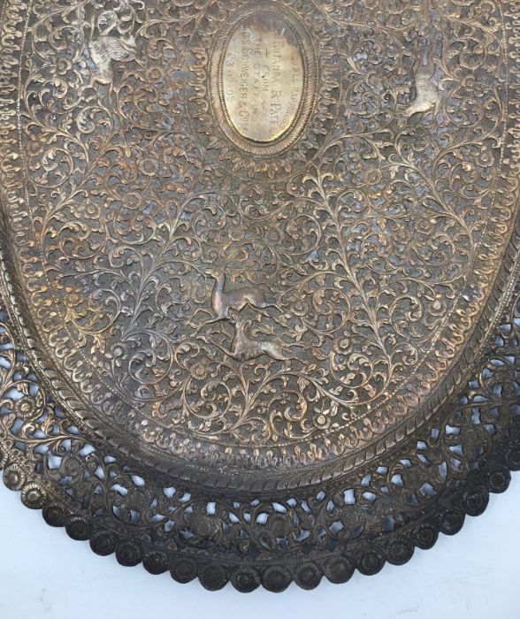 An early 20th century Indian white metal presentation oval plate, repousse scrolling foliage and - Image 3 of 5