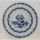 An 18th century Bristol Delftware charger, painted in blue, diameter 34.3cm, height 5.3cm. Condition