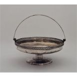 A silver swing handled pedestal basket, by Martin Hall & Co Ltd, Sheffield 1913, with pierced