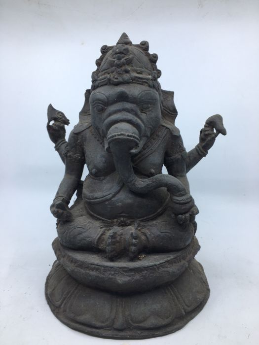 A late 20th century Indian bronze figure of four armed Ganesha seated, height 29cm.