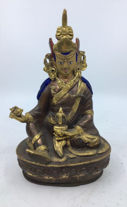 A 20th century Sino-Tibetan polychrome painted gilt-copper figure of seated Vajrasattva, height