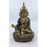 A 20th century Sino-Tibetan polychrome painted gilt-copper figure of seated Vajrasattva, height