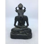 A 20th century Indian bronze figure of a seated deity, height 20cm.