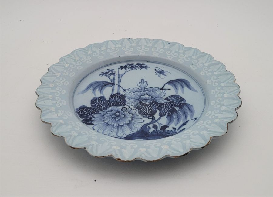 Two mid 18th century English Delftware plates, both with blue ground and with rim painted bianco- - Image 5 of 6